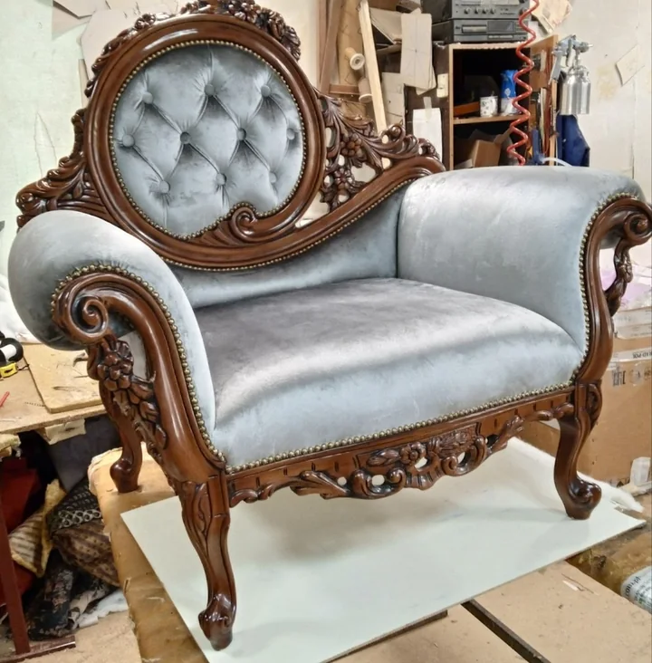 Grey armchair with an oval backrest